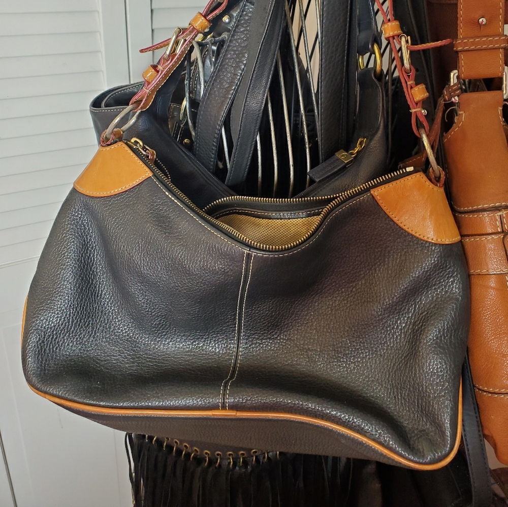 Dooney and Bourke black and tan "All Weather Leath